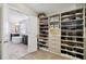 Spacious walk-in closet with shelving for shoes, clothes, and accessories at 320 Harvest View Ter, Woodstock, GA 30188