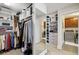 Walk-in closet with built-in storage and access to laundry room at 320 Harvest View Ter, Woodstock, GA 30188