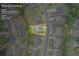 An aerial view of a home with an approximate lot line of 0.23 acres in a suburban neighborhood at 4769 Moon Hollow Ct, Buford, GA 30519