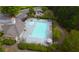 Aerial view of community pool featuring a mushroom fountain and a pool house at 4769 Moon Hollow Ct, Buford, GA 30519