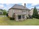 Well-maintained backyard with screened-in patio, and lush landscaping at 4769 Moon Hollow Ct, Buford, GA 30519