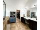 Bathroom boasting double vanity, a cabinet, and a view to the walk-in closet at 4769 Moon Hollow Ct, Buford, GA 30519