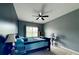 Comfortable bedroom with a ceiling fan, window, and ample space at 4769 Moon Hollow Ct, Buford, GA 30519