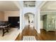 Grand foyer featuring hardwood floors, archway, and an open staircase to the second level at 4769 Moon Hollow Ct, Buford, GA 30519