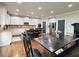 Spacious kitchen featuring an island with seating, stainless steel appliances, and hardwood floors at 4769 Moon Hollow Ct, Buford, GA 30519
