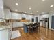 A modern kitchen with granite counters, a kitchen island, and stainless steel appliances at 4769 Moon Hollow Ct, Buford, GA 30519