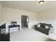 Bright and airy living room featuring sofas, a small desk, and neutral walls at 4769 Moon Hollow Ct, Buford, GA 30519