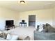 Spacious living room with neutral walls, carpet flooring, and comfortable sofas at 4769 Moon Hollow Ct, Buford, GA 30519