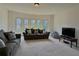 Spacious living room with carpet and lots of natural light at 4769 Moon Hollow Ct, Buford, GA 30519
