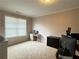 Bright office space with neutral paint, large window, and work space at 4769 Moon Hollow Ct, Buford, GA 30519