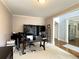 Office featuring neutral paint, large workstation with multiple monitors, and hardwood floors at 4769 Moon Hollow Ct, Buford, GA 30519