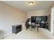 Comfortable office featuring neutral paint, large workstation with multiple monitors, and ample room at 4769 Moon Hollow Ct, Buford, GA 30519