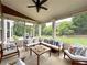 Outdoor screened-in patio with comfortable seating at 4769 Moon Hollow Ct, Buford, GA 30519