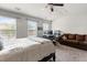 Well-lit bedroom offers a comfortable seating area, work space, and scenic views at 1539 Creek Bend Ln, Lawrenceville, GA 30043