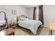 Bright bedroom featuring a comfortable bed, stylish decor, and natural light at 1539 Creek Bend Ln, Lawrenceville, GA 30043