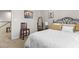 Cozy bedroom showcasing a wrought iron bed frame and neutral color scheme at 1539 Creek Bend Ln, Lawrenceville, GA 30043