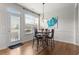 Bright dining area with access to the backyard and a stylish light fixture at 1539 Creek Bend Ln, Lawrenceville, GA 30043