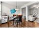 Inviting dining area with a modern light fixture and open layout to the living room at 1539 Creek Bend Ln, Lawrenceville, GA 30043