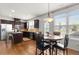 Modern kitchen with stainless steel appliances, an island, and adjacent dining area at 1539 Creek Bend Ln, Lawrenceville, GA 30043