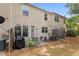 Back patio with outdoor furniture and grill, perfect for relaxing or entertaining in a fenced yard at 1539 Creek Bend Ln, Lawrenceville, GA 30043