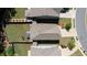 An aerial view of a home showing a well manicured lawn, garden area, and driveway at 156 Woodhouse Cir, Acworth, GA 30102