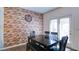 Cozy dining area with a modern table, seating, and a decorative accent wall at 156 Woodhouse Cir, Acworth, GA 30102