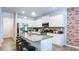 Modern kitchen with stainless steel appliances, a granite island, and white cabinets at 156 Woodhouse Cir, Acworth, GA 30102
