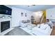 Bright living room featuring a fireplace, modern decor, and a comfortable seating area at 156 Woodhouse Cir, Acworth, GA 30102