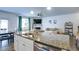 Open-concept living room featuring a fireplace, plenty of natural light, and a combined kitchen and dining area at 156 Woodhouse Cir, Acworth, GA 30102