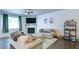Comfortable living room with a fireplace, stylish furniture, and contemporary decor at 156 Woodhouse Cir, Acworth, GA 30102