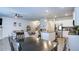 Spacious open-concept living area with a kitchen, dining space, and comfortable seating at 156 Woodhouse Cir, Acworth, GA 30102