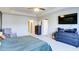 Airy bedroom with a tray ceiling, large window, entertainment center, comfortable seating, and plush carpet flooring at 156 Woodhouse Cir, Acworth, GA 30102