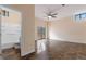 Unfinished basement space with tile flooring, ceiling fan, and sliding glass door to the backyard at 2325 Lago Dr, Jonesboro, GA 30236