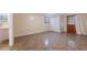 Spacious basement featuring tiled flooring, a window, closet, and door to the outside at 2325 Lago Dr, Jonesboro, GA 30236