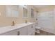 Bathroom features a new double vanity with modern fixtures and a shower-tub combo at 2325 Lago Dr, Jonesboro, GA 30236