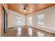 Bright sunroom boasts wood paneling, multiple windows, and sliding glass doors at 2325 Lago Dr, Jonesboro, GA 30236