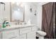 Bathroom with a white vanity, marble countertop, and a framed mirror with a shower at 295 N Fayette Dr, Fayetteville, GA 30214
