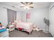 Cozy bedroom with a ceiling fan, cute decorations, and carpeted floors at 295 N Fayette Dr, Fayetteville, GA 30214
