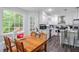 Eat-in kitchen featuring stainless steel appliances, an island, and a breakfast area at 295 N Fayette Dr, Fayetteville, GA 30214