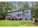 Back exterior of a two-story home with a deck and backyard at 295 N Fayette Dr, Fayetteville, GA 30214