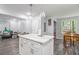 Open concept kitchen island providing an open transition to the dining and living areas at 295 N Fayette Dr, Fayetteville, GA 30214