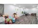 Bright living room featuring wood look flooring and a white front door at 295 N Fayette Dr, Fayetteville, GA 30214