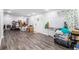 Spacious living room featuring wood look flooring, a white front door, and a whiteboard at 295 N Fayette Dr, Fayetteville, GA 30214