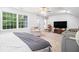 Large main bedroom with a sitting area, ceiling fan, and carpeted floors at 295 N Fayette Dr, Fayetteville, GA 30214