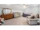 Large main bedroom with vaulted ceilings, ceiling fan, a sitting area and carpeted floors at 295 N Fayette Dr, Fayetteville, GA 30214