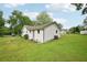 Backyard view of home featuring white siding and spacious yard at 6648 Florence Dr, Lithia Springs, GA 30122