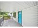Close-up of the front porch, highlighting the vibrant blue front door and white siding at 6648 Florence Dr, Lithia Springs, GA 30122
