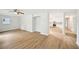 Bright and airy living room featuring modern hardwood floors and neutral paint at 6648 Florence Dr, Lithia Springs, GA 30122