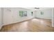 Spacious living room with abundant natural light, hardwood floors, and a ceiling fan at 6648 Florence Dr, Lithia Springs, GA 30122