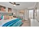 Nicely appointed bedroom with plush bedding, art, and lots of light from a window and ceiling fan at 1750 Clairmont Rd # 32, Decatur, GA 30033